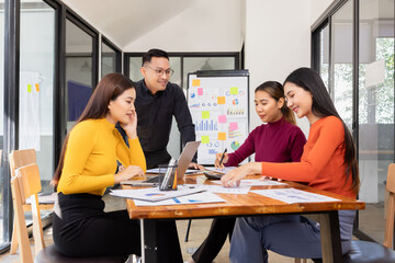 Fototapeta premium Group of Asian business working analysis project brainstorm in modern office, Asian businesspeople team working together, Business startup and company strategy planning concept.