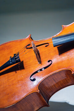 Close-up of a cello's elegant curves and strings