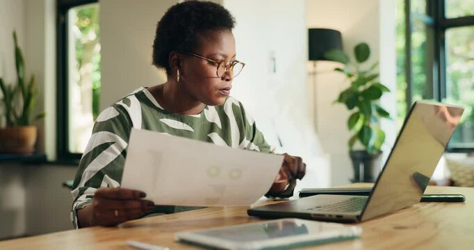 Black woman, documents and home with laptop for analysis, performance review or statistics. Female person, accountant or financial analyst with paperwork on computer for finance or budget at house