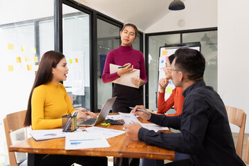 Group of Asian business working analysis project brainstorm in modern office, Asian businesspeople team working together, Business startup and company strategy planning concept.