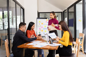 Group of Asian business working analysis project brainstorm in modern office, Asian businesspeople...