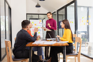 Group of Asian business people working together and presentation a meeting in office, 