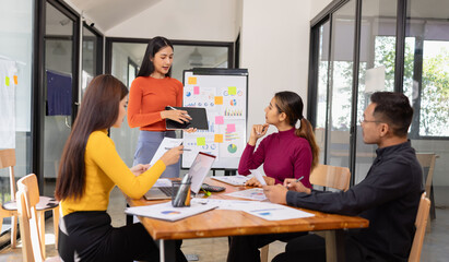 Group of Asian business people working together and presentation a meeting in office, 