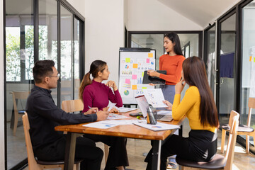 Group of Asian business people working together and presentation a meeting in office, 