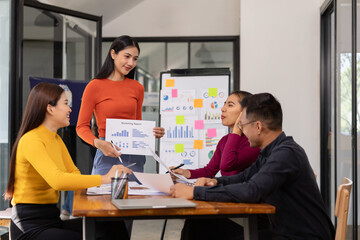 Obraz premium Group of Asian business people working together and presentation a meeting in office, 
