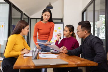 Group of Asian business people working together and presentation a meeting in office, 