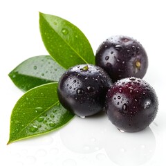 Freshly picked acai berries with vibrant green leaves and water droplets on a white background.