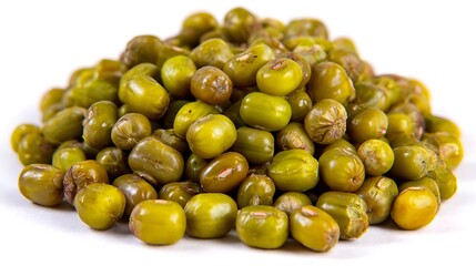 Freshly harvested green mung beans pile against a clean white background close up view