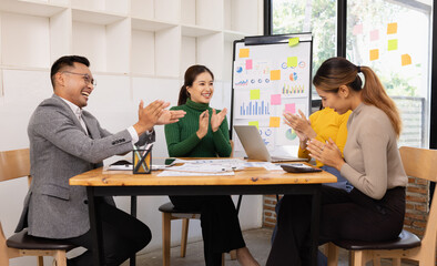 Group of business people working together with dashboard analysis and data management in conference...