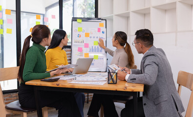 Fototapeta premium Group of business people working together with dashboard analysis and data management in conference room, Corporate business and dashboard to presentation concept.