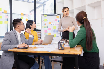 Fototapeta premium Group of business people working together with dashboard analysis and data management in conference room, Corporate business and dashboard to presentation concept.
