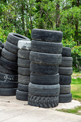 Abandoned used car tires in urban outdoor areas.