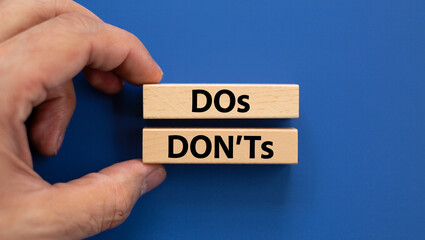Dos and donts wooden blocks guidance concept