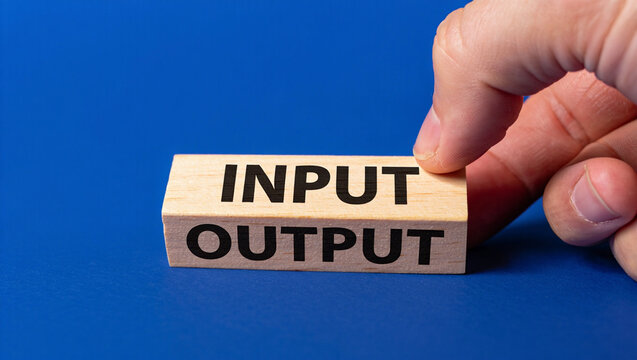 Input output concept wooden blocks business process hand