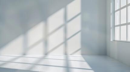 Minimalist sunlit room with geometric light and shadow patterns on white walls