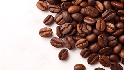 Obraz premium Close-up of roasted coffee beans, showcasing their rich color and texture. Perfect for coffee lovers and culinary enthusiasts., coffee beans isolated on white background.