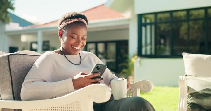 Smile, black woman and reading with phone at house for browsing internet, social media and weekend. Coffee, female person or mobile for downloading ebook, streaming movie and funny videos in backyard