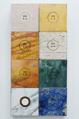 Sockets of different materials and colors installed on the wall