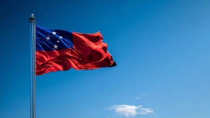 Celebration of Samoa's Independence Day with the national flag waving in a clear blue sky