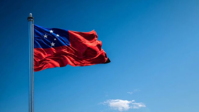 Celebration of Samoa's Independence Day with the national flag waving in a clear blue sky