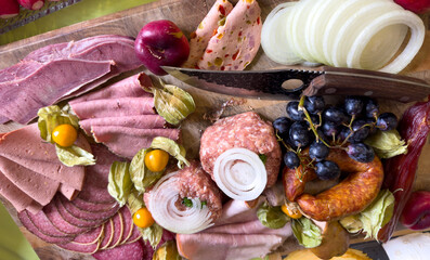 Sausage platter with different types of sausage on a wooden board