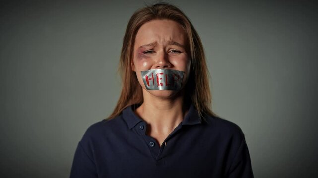 Woman in Distress with Tape Over Mouth Crying Helplessly