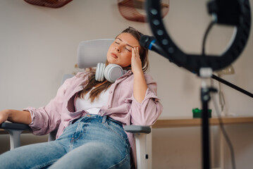 Content creator feeling tired while recording a podcast at home