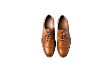 Pair of elegant brown leather oxford shoes with lace-up closure, isolated on transparent background. background removed