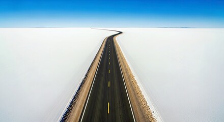 Asphalt Road Bisecting Bright White Salt Flats