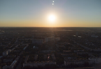Aerial view of Kharkiv housing district with sun shining on clear sky above, a peaceful city day