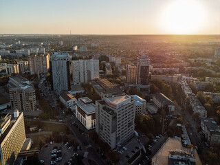 Evening aerial of modern neighborhood in Kharkiv, Ukraine, with soft sunset light and clear sky