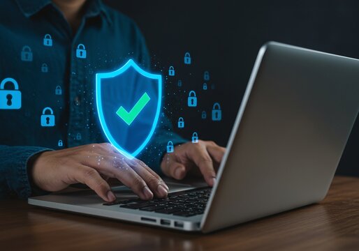 Photo of hands typing on a laptop with a glowing security shield and lock icons, illustrating cybersecurity