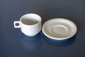 elegant minimalist white ceramic cup isolated on smooth surface