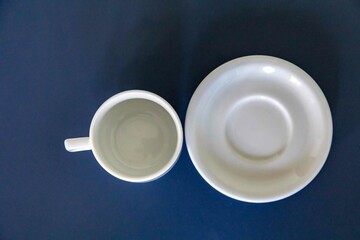 elegant minimalist white ceramic cup isolated on smooth surface