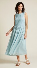 Naklejka premium Elegant Light Blue Pleated Midi Dress Perfect for Summer Events