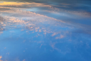 Nature sky background. Beautiful landscape with clouds and orange sun on sky. 