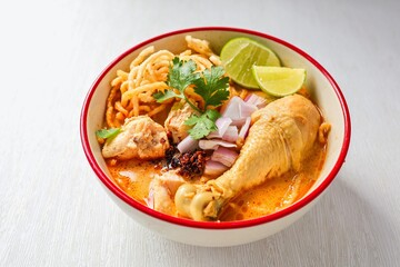 Northern thai curry Noodles with chicken on white background , Thai called  khao soi kai ,Northern food of thailand