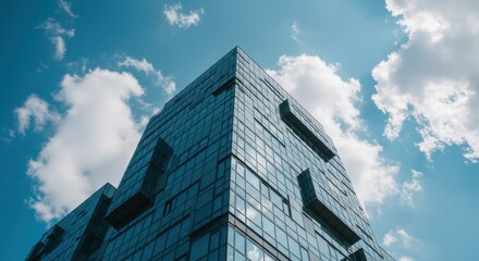 Modern Glass Skyscraper against a Blue Sky