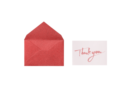 A cutout of a red lamé envelope with a pink handwritten thank you message card, overhead view