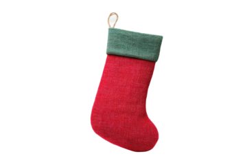 Festive red and green christmas stocking with loop on black background, cut out