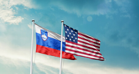 Slovenia and America friendship flags are waving in the sky.Two country flag for agreement or deal. Slovenia USA national flag for commitment.