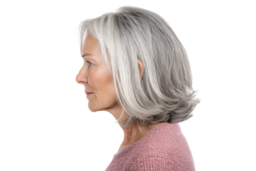 Profile of mature caucasian female with gray hair against black background, cut out