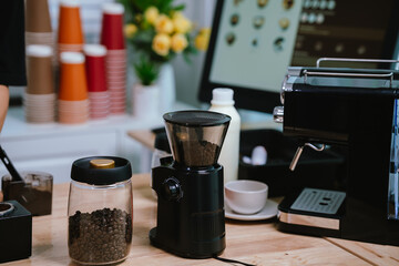 Barista pouring milk into cappuccino, creating latte art in cozy café setting, showcasing morning preparation, craftsmanship, and coffee culture indoors.