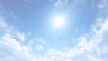 夏の太陽が輝くリアルな青空と白い雲の背景