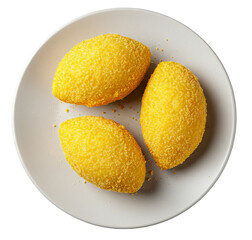 Top view of a white plate with three traditional Brazilian cornmeal dumplings (bolinho de milho) coated in yellow corn flour, isolated on a transparent background