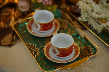 Elegant Teacups on Ornate Tray A Festive Table Setting