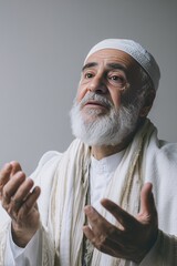 Sheikh passionately delivering a Mawlid lecture in a white studio backdrop, showcasing authentic emotion and expressiveness