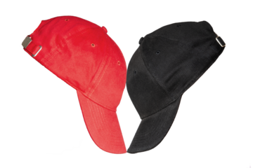 A head-on confrontation between a red and a black baseball cap placed opposite each other. It symbolizes a political confrontation between two contradictory sides.