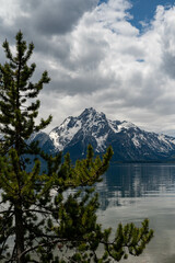 View of the Grand Teton Mountains over calm lake