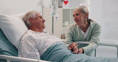 Talking, hospital bed and senior couple for comfort, support and empathy for recovery. Healthcare, marriage and mature woman visit man and holding hands for compassion, care and help for wellness - Powered by Adobe